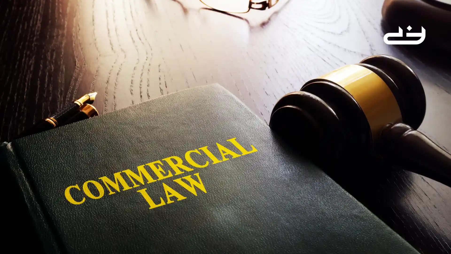 Commercial Law book on a table with a gave and a pair of glasses